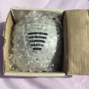 Pest Repellers Plug Wall Sunbeam with old cardboard box